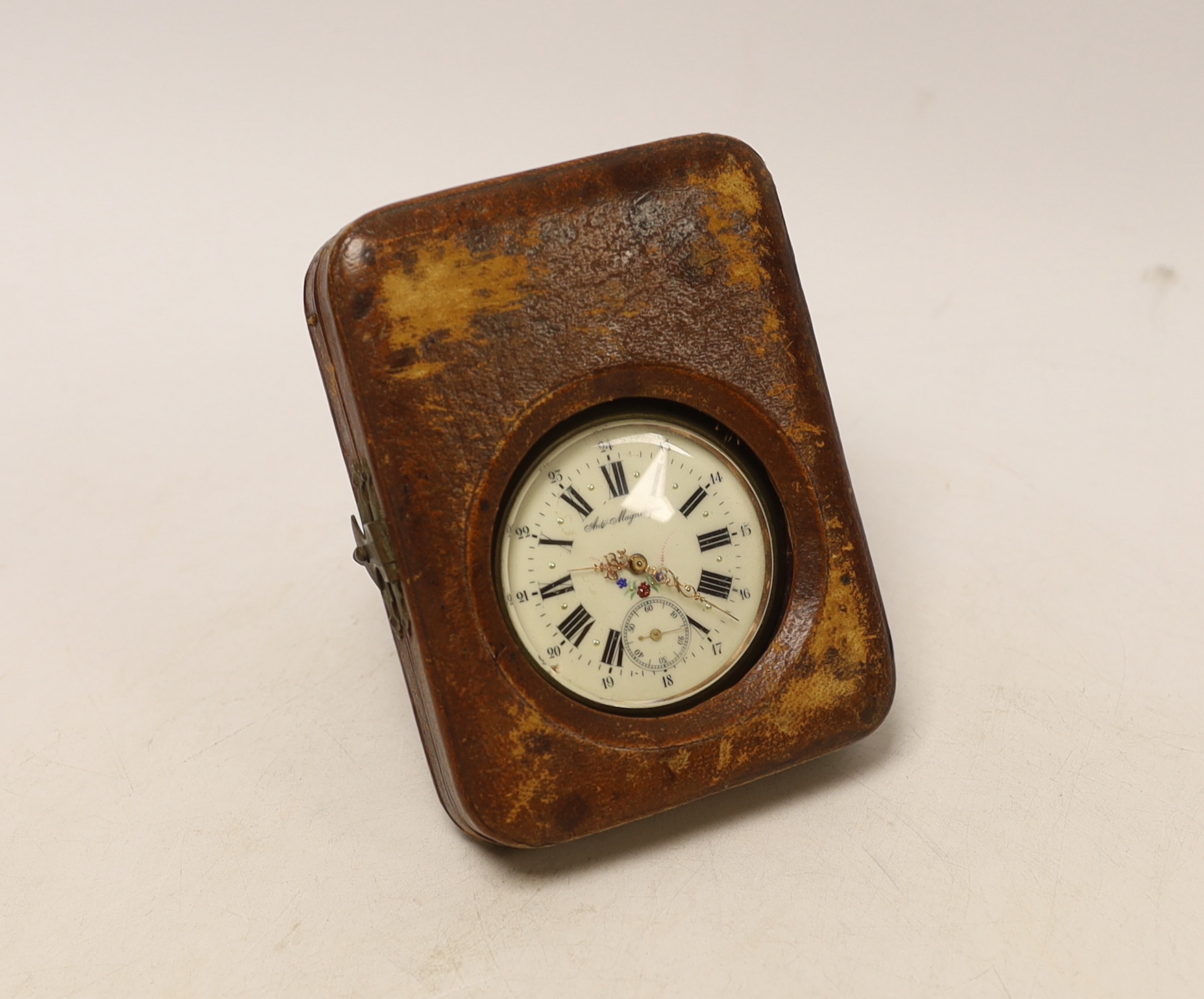 An early 20th century French nickel cased keyless pocket watch, with Roman dial and subsidiary seconds, case diameter 65mm, in leather carrying case.
